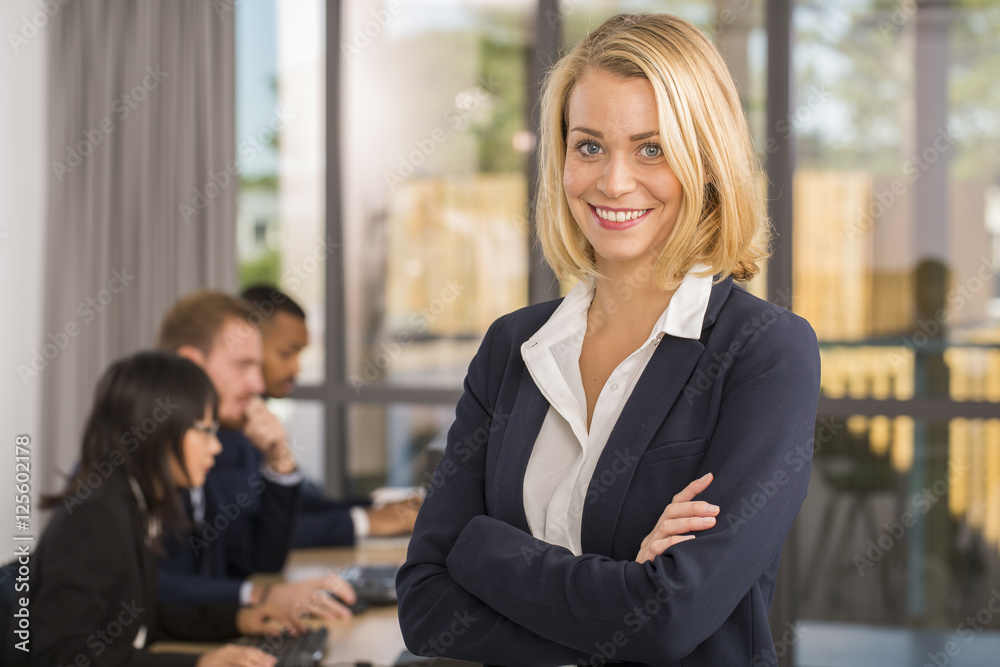 Attrative business womanstanding at office Attrative business womanstanding at office