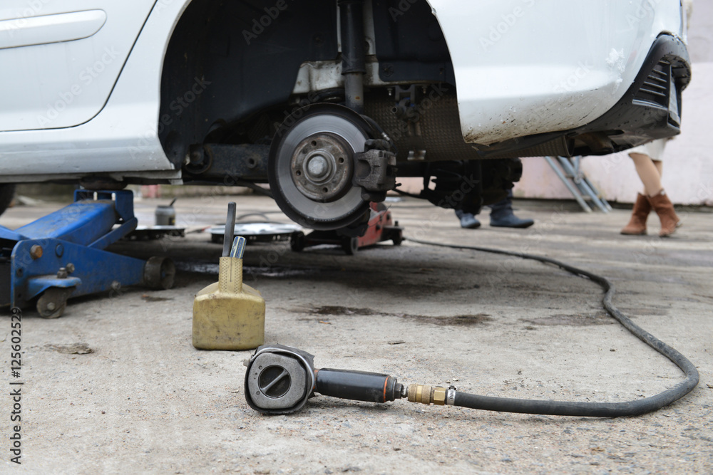 tire, the car on the jack, replacement of rubber, shallow dof tire, the car on the jack, replacement of rubber, shallow dof
