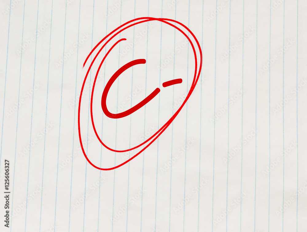 c-minus-c-grade-written-in-red-on-notebook-paper-stock-photo-adobe