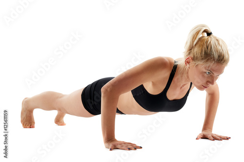 Fitness girl doing pushups