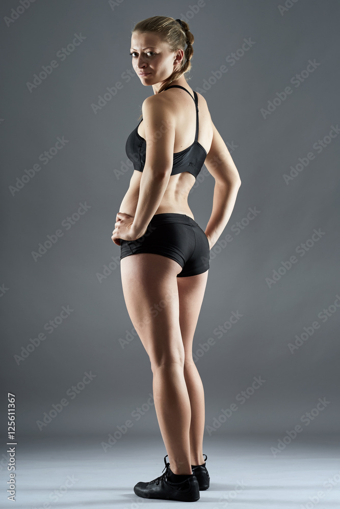 Fitness model posing Fitness model posing