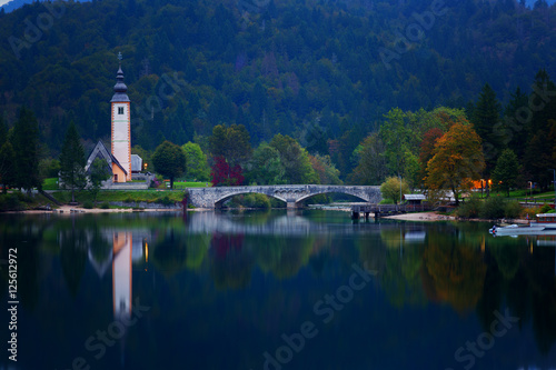 Night view of the stone bridge and the Church of St. John the Baptist at Lake Bohinj (Bohinjsko jezero), Slovenia