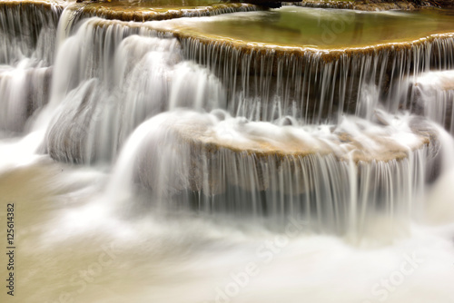 Waterfall in tropical deep forest