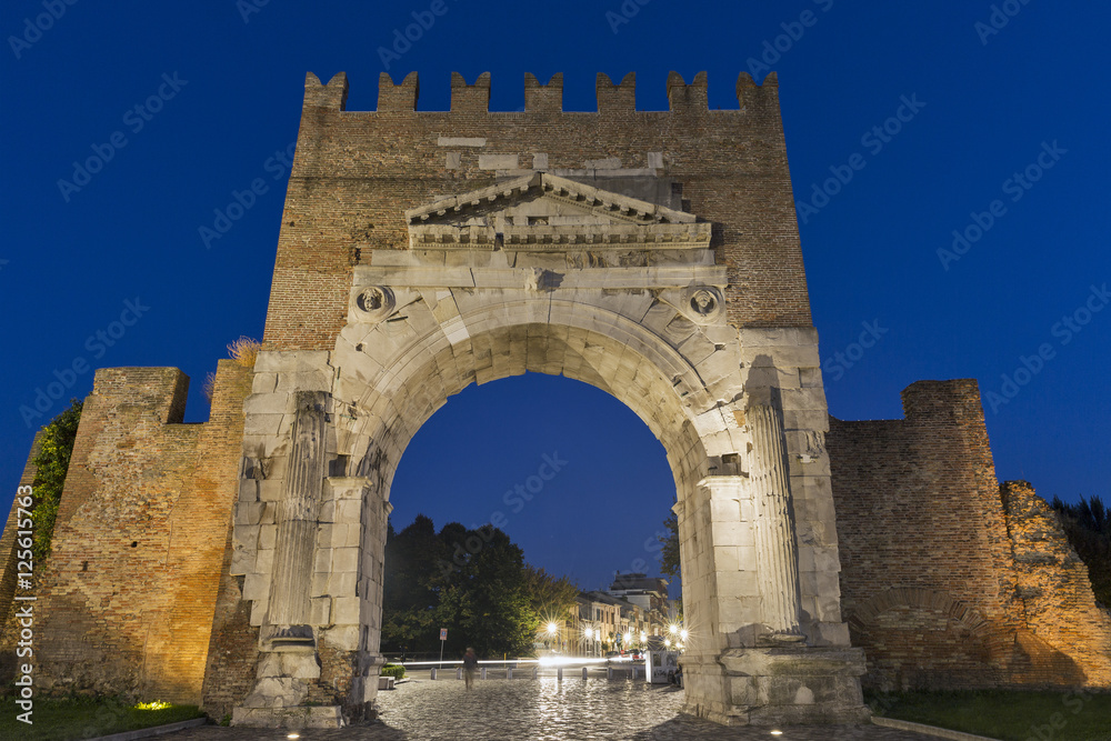 Arch of Augustus at night in Rimini, Italy