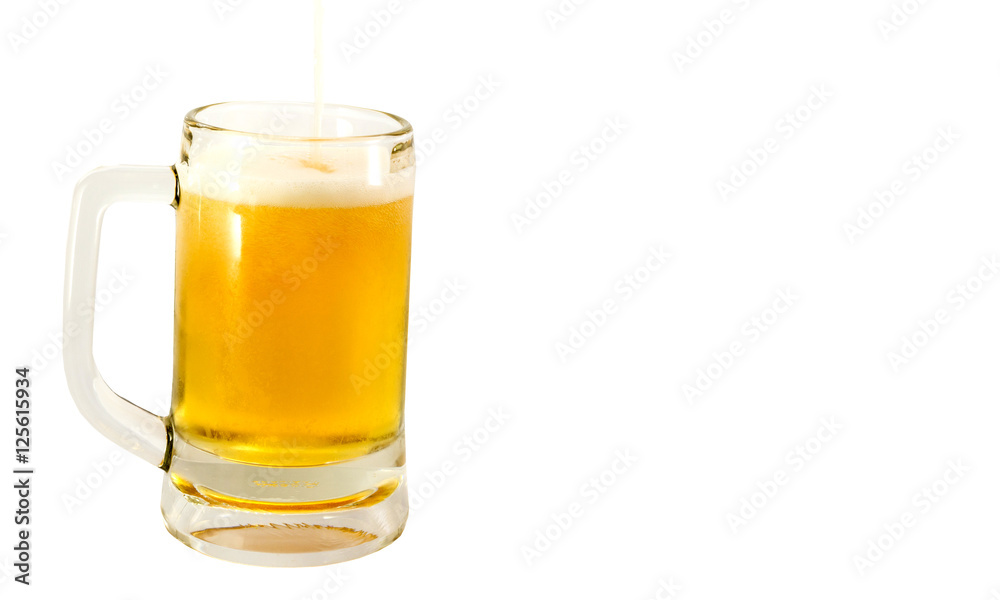 cold mug of beer with foam isolated on white background cold mug of beer with foam isolated on white background
