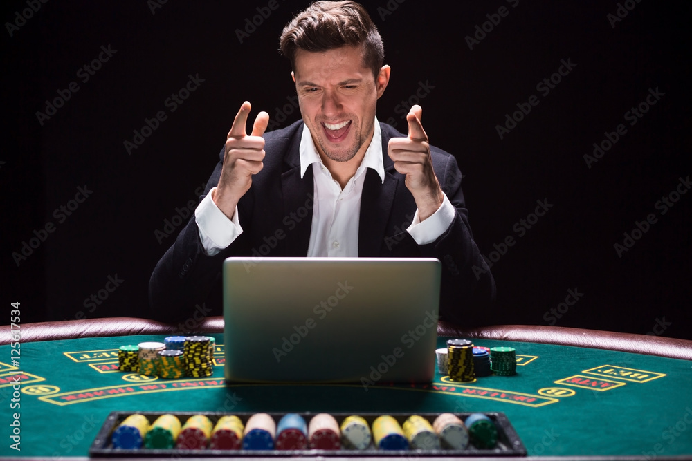 Online poker players sitting at the table Online poker players sitting at the table