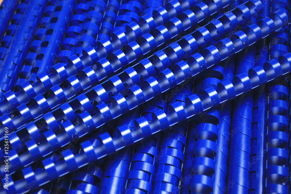 many blue plastic binding combs-clouseup. many blue plastic binding combs-clouseup.