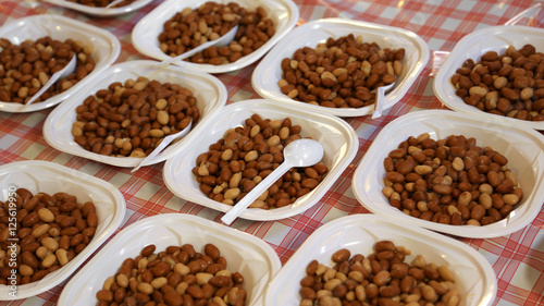 dishes filled with boiled beans during the village feast