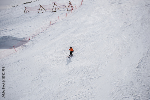 Little skier on a ski slope.