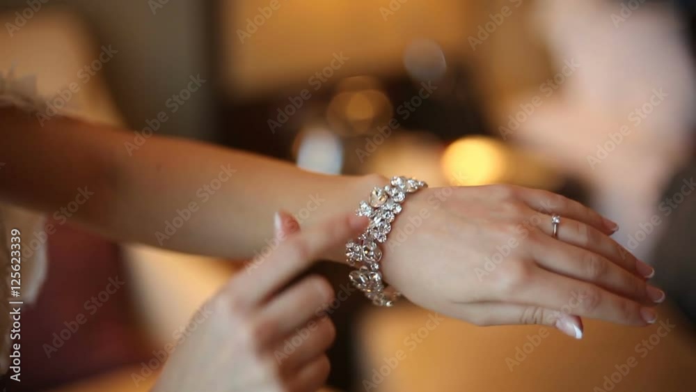 Woman with diamond bracelet on her wrist