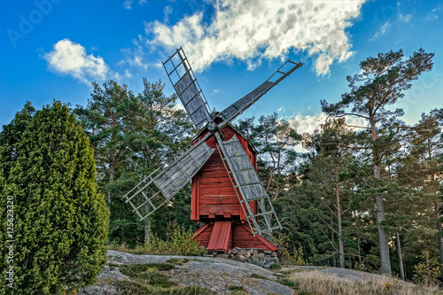 Red ochre colour wooden windmill