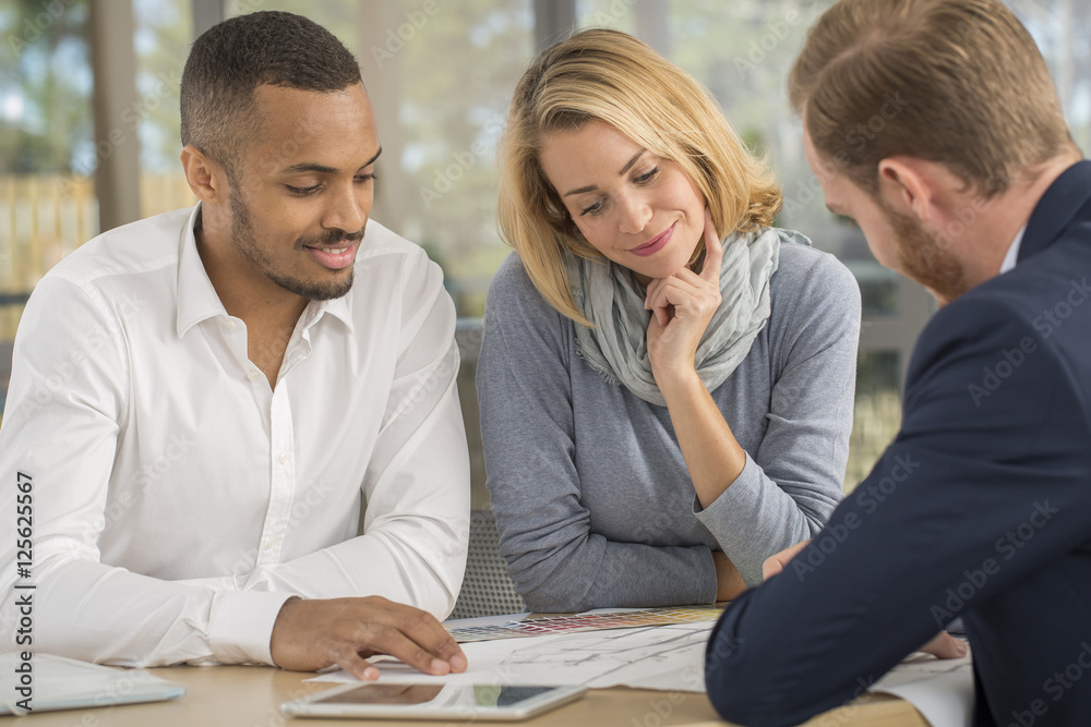 Mutiracial couple with a .real estate agent Mutiracial couple with a .real estate agent