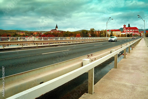 road bridge over the river Elbe with autumnal town of Litomerice in the background in czech republic
