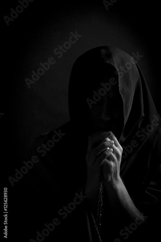 Catholic monk with a rosary