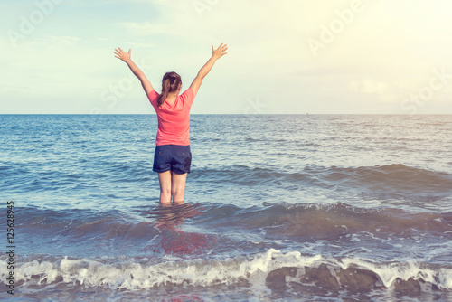 Woman standing alone outdoor in the sea