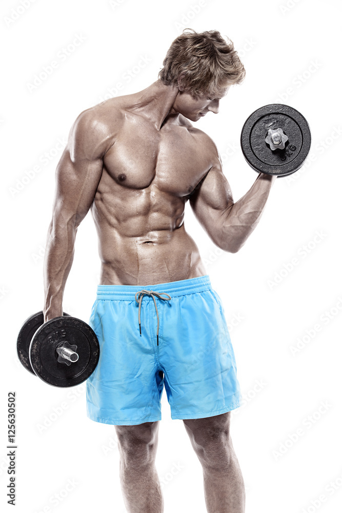 Muscular bodybuilder guy doing exercises with dumbbells Muscular bodybuilder guy doing exercises with dumbbells