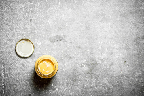 Jar with fresh mustard.