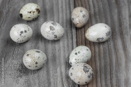 Quail eggs on the wooden boards