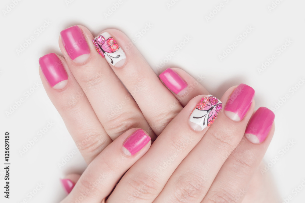 Multi-colored jelly sweets in the hands with a bright nail polish Multi-colored jelly sweets in the hands with a bright nail polish
