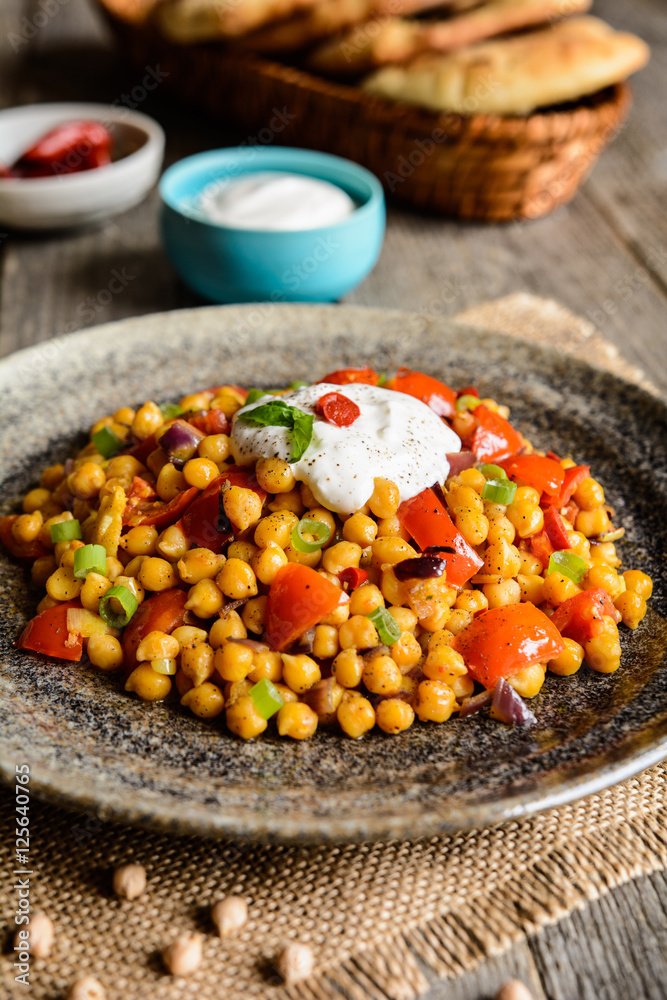 Traditional Indian Channa Masala – spicy chick peas with tomato, pepper and curry Traditional Indian Channa Masala – spicy chick peas with tomato, pepper and curry