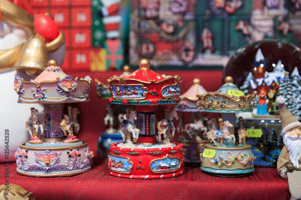 Colorful close up details of christmas fair market. Animal carousel decorations for sales
