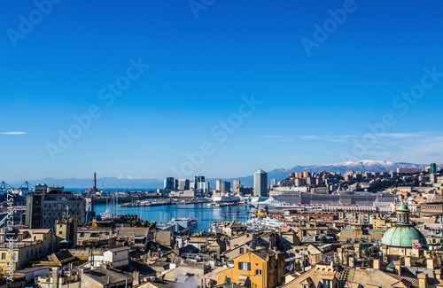 Fototapeta Naklejka Na Ścianę i Meble -  GENOA, ITALY,  February 1  2015: Panoramic view of old city and port of Genoa in a winter day under a beautiful blue sky / landscape/city/ view/ port/ city/ blue/ sky