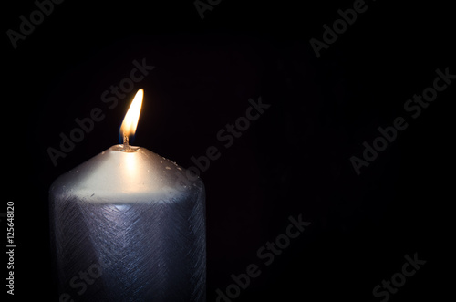 silver burning candle