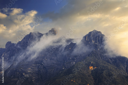 mount kinabalu covered in clouds,  sabah, malaysia photo