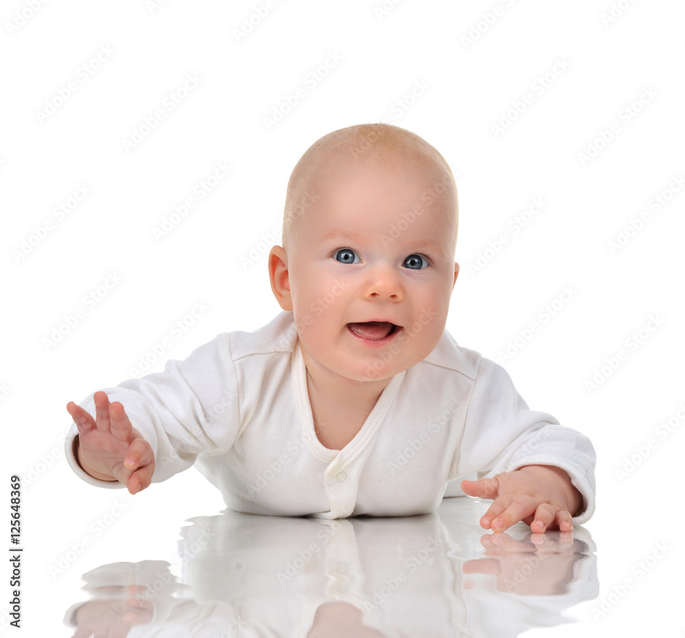 Four month Infant child baby girl lying on a floor happy smiling Four month Infant child baby girl lying on a floor happy smiling