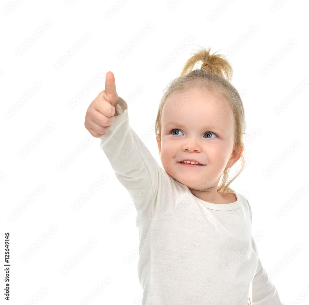 Child baby girl happy looking up smiling with hand thumb up sign Child baby girl happy looking up smiling with hand thumb up sign