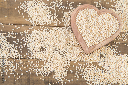 Quinoa seeds in wooden bowl
