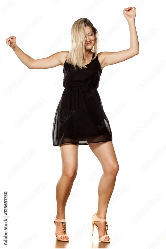 beautiful young woman dancing with wih short black dress beautiful young woman dancing with wih short black dress