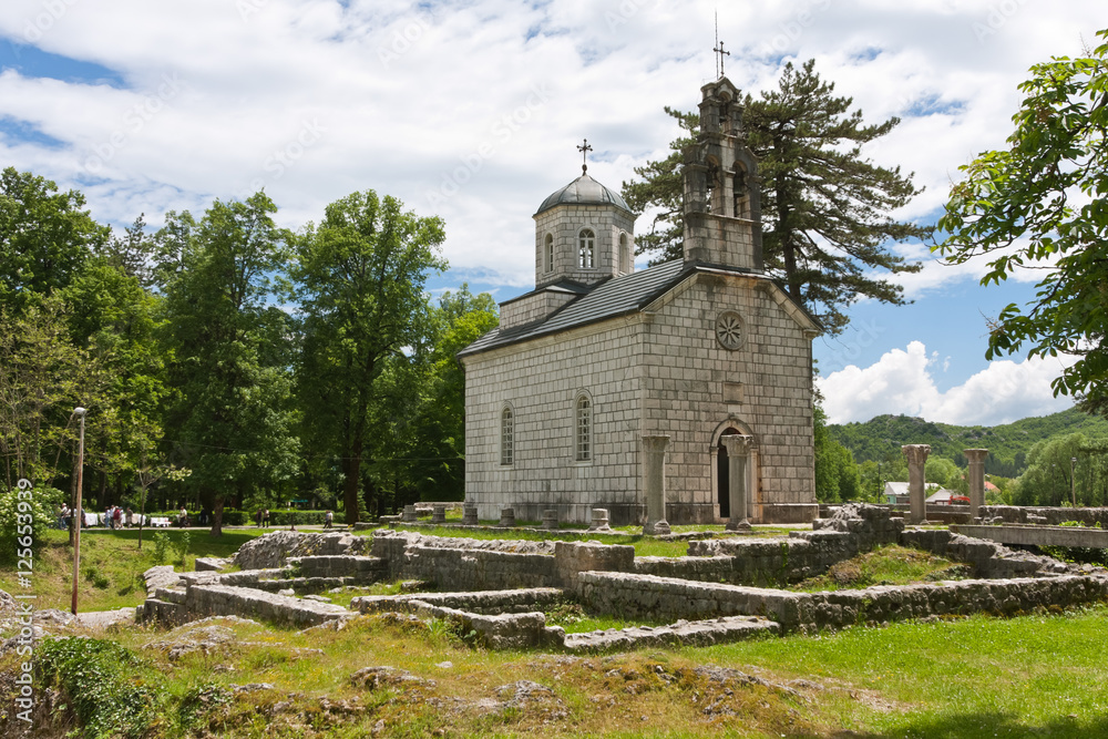 Fototapeta premium Orthodox church among ruins in Cetinje, Montenegro