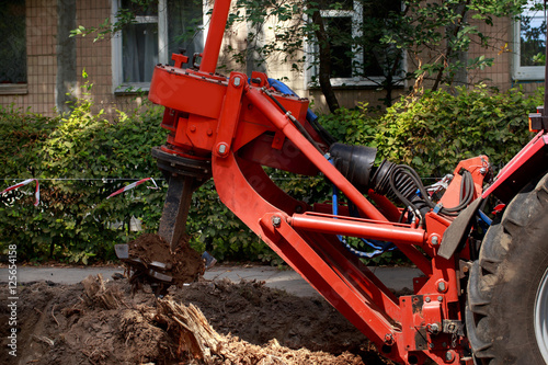 Bild auf Leinwand Machine for uprooting stumps
