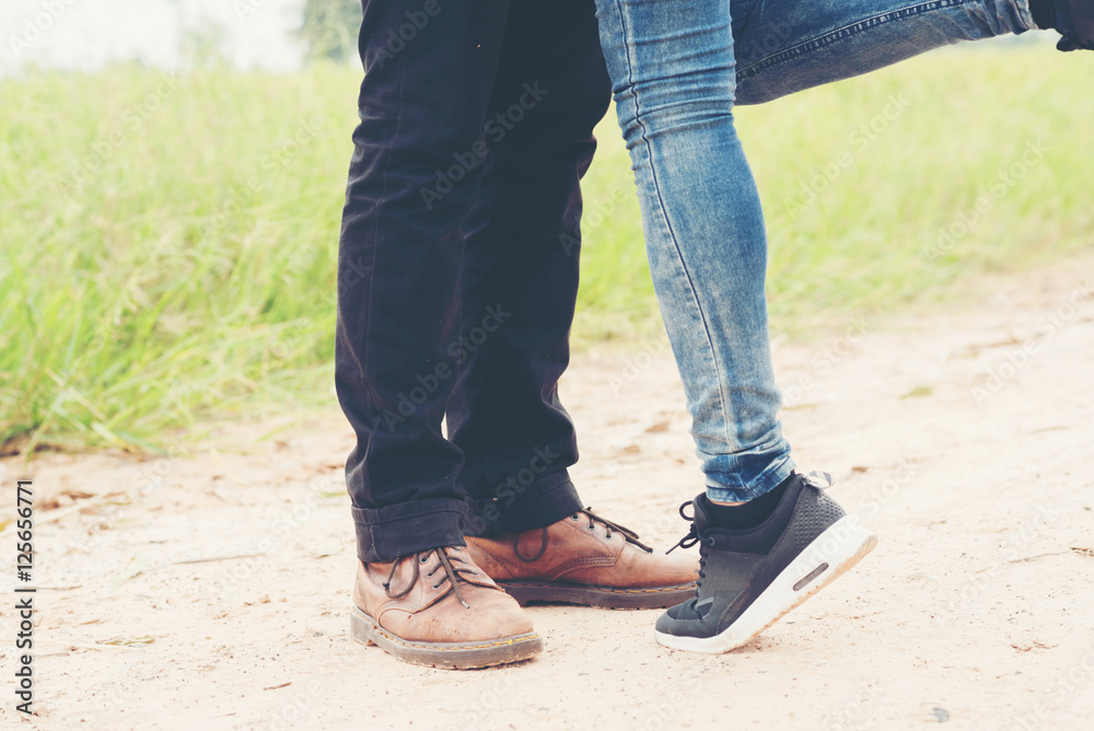 Young couple in love kissing in meadows field. Young couple in love kissing in meadows field.