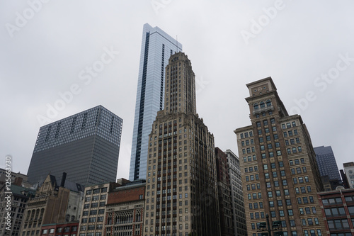 Buildings from the Chicago against foggy and cloudy sky