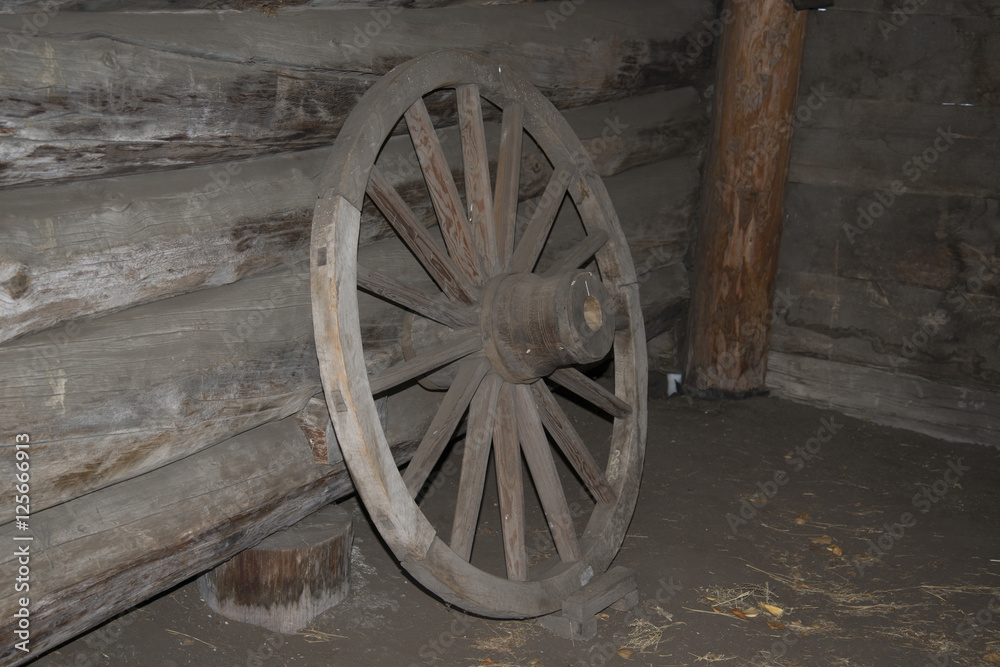 Obraz premium Vintage wooden wagon wheel.