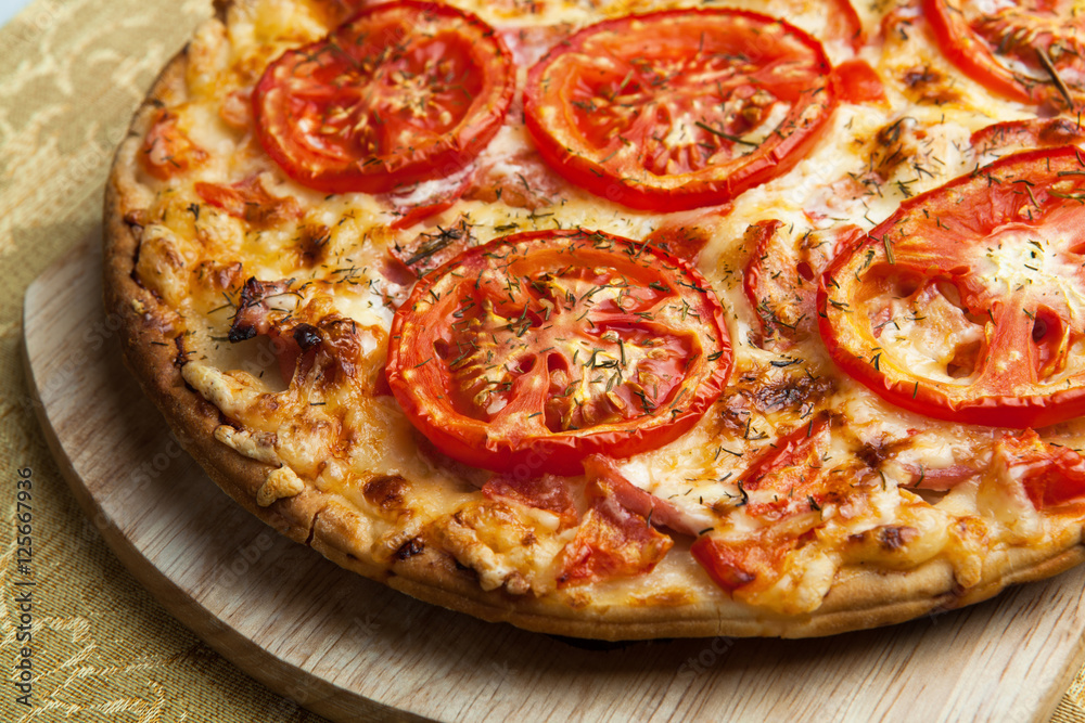 136411 ready pizza with tomatoes close up 136411 ready pizza with tomatoes close up