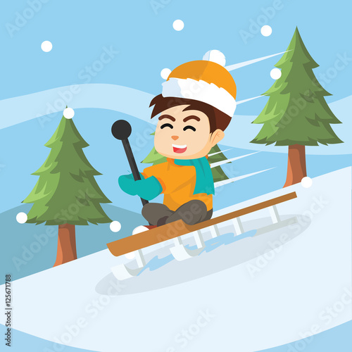 boy sliding with sled