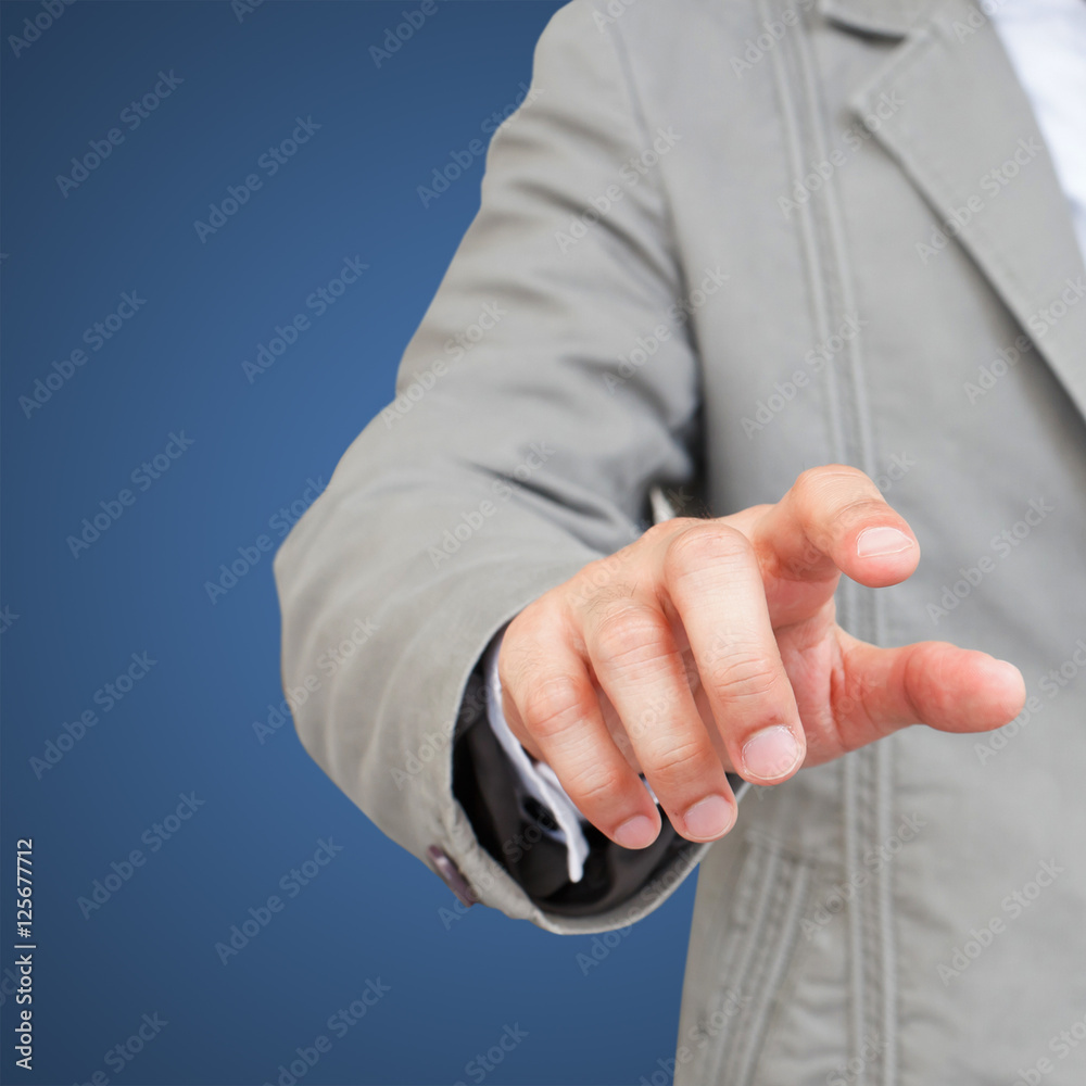 Business man touching an imaginary screen Business man touching an imaginary screen