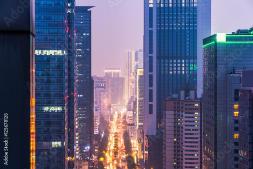 illuminated modern buildings at night in China.