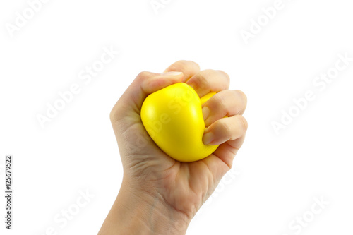 Woman hand squeezing a stress ball  on white background