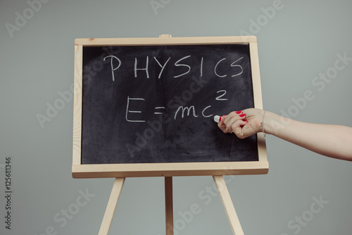 Tapety artystyczne Physics word and formula E=mc2 on chalkboard