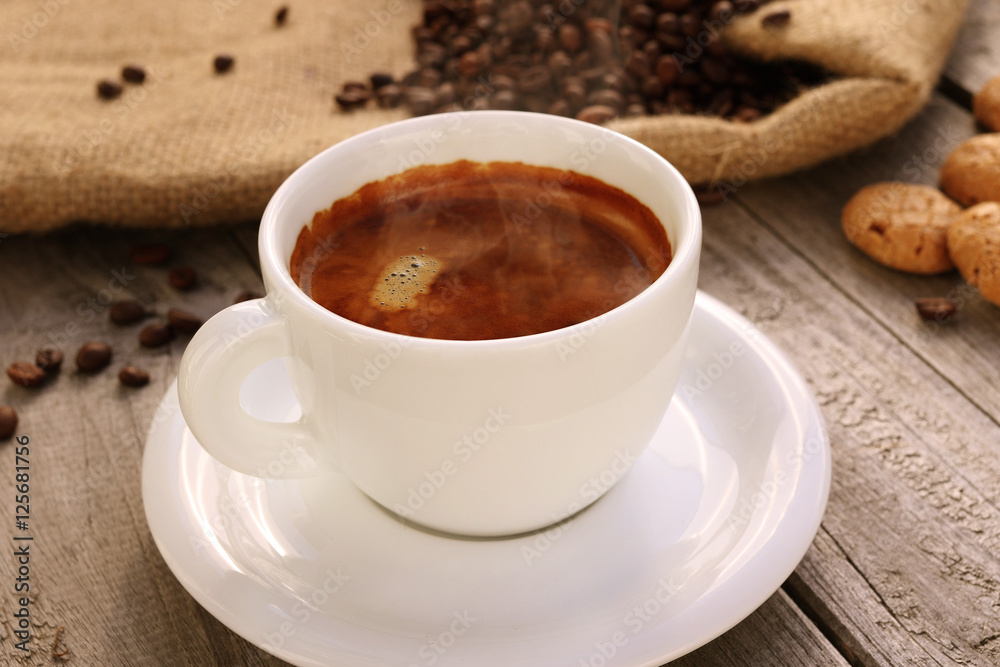 Cup of hot coffee on wooden surface Cup of hot coffee on wooden surface