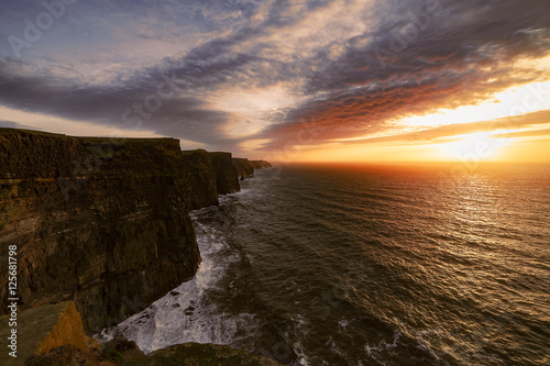 Cliffs of Moher under the sunset lights
