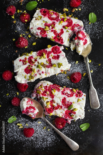 semifredo, italian ice cream dessert, with raspberry and pistach photo