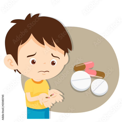 young boy is not happy about taking medicine.