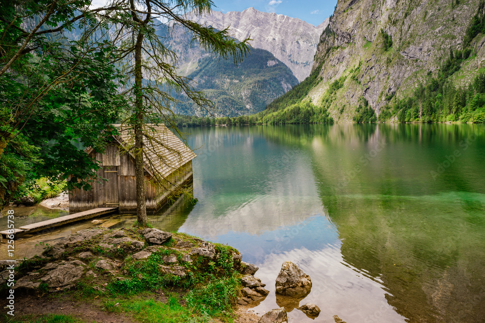 Small wooden boathouse at Obersee lake, Germany