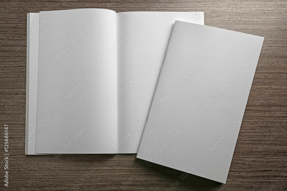 Blank brochures on wooden background Blank brochures on wooden background