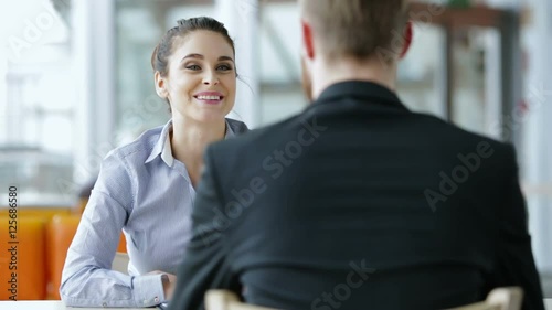 Job interview - happy recriuter shaking hand with candidate